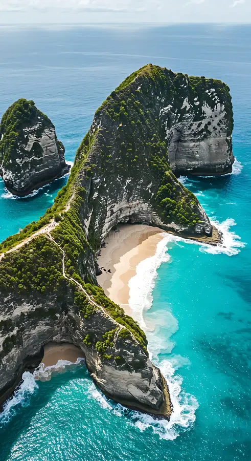 Kelingking Beach on Nusa Penida, below a green headland shaped like a T-rex