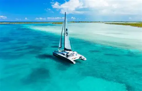 Catamaran anchored in calm, clear turquoise water