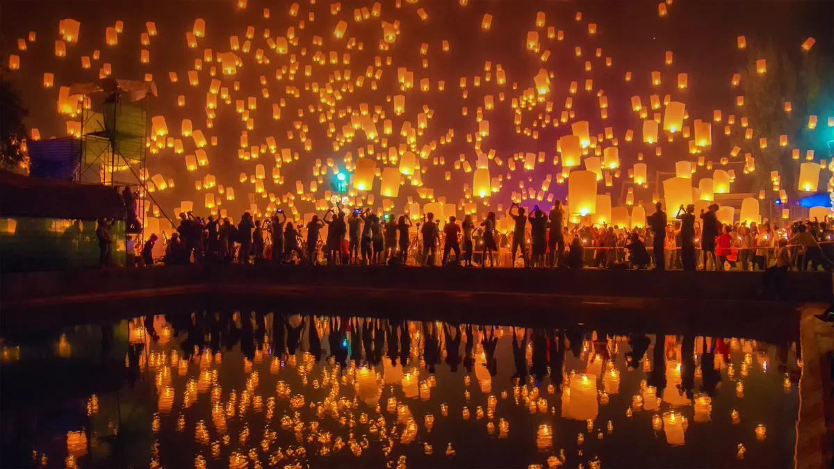 Lanterns rising into the night sky at Yi Peng, Chiang Mai