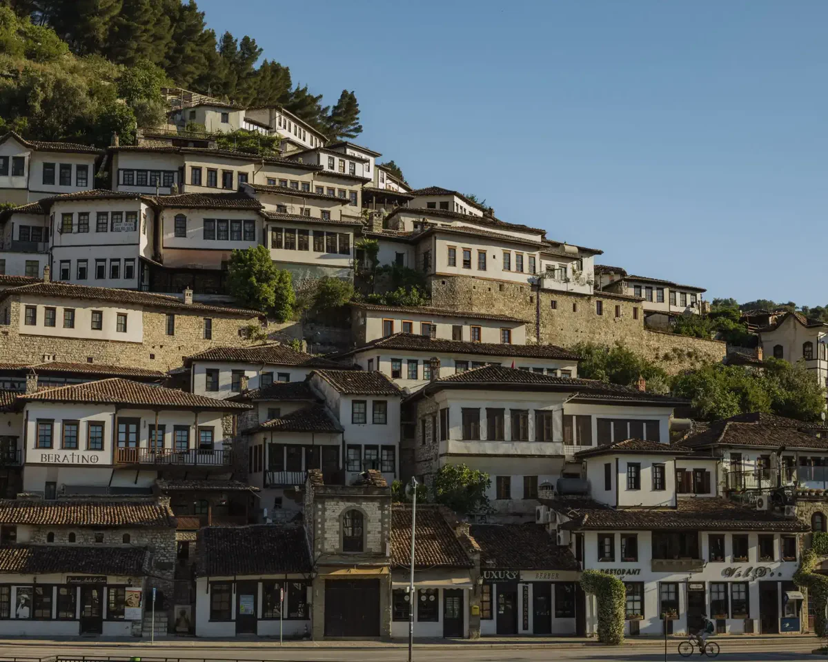 White Ottoman houses with rows of windows on the hillside in Berat, Albania