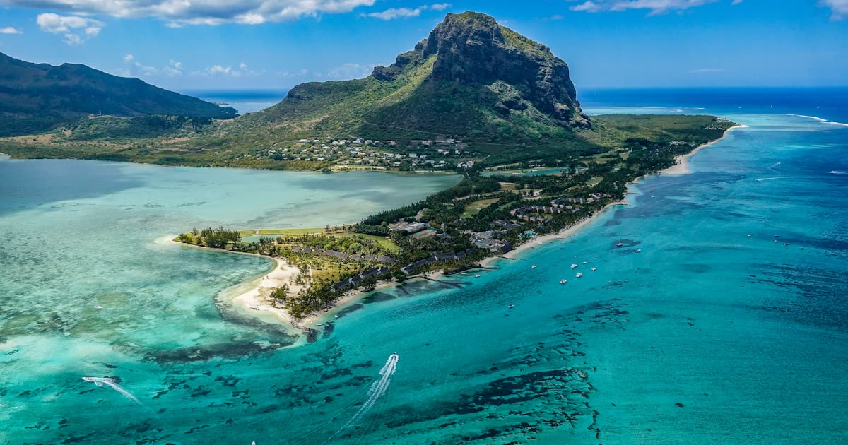 Le Morne Brabant mountain rising over the turquoise lagoon, Mauritius